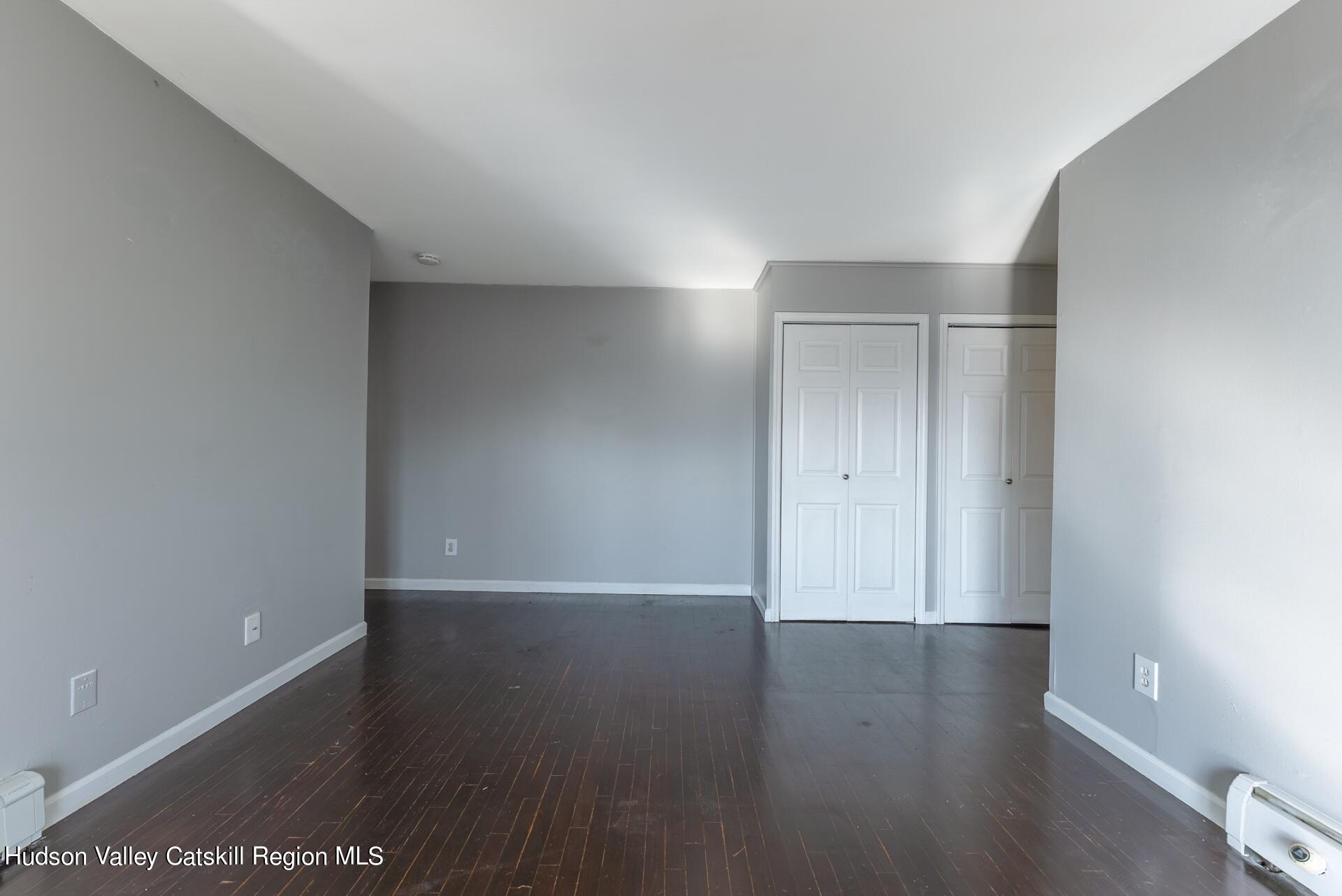 6 Colonial Road, Unit 46 Beacon, NY 12508 - Photo 11 of 19 a view of an empty room with wooden floor