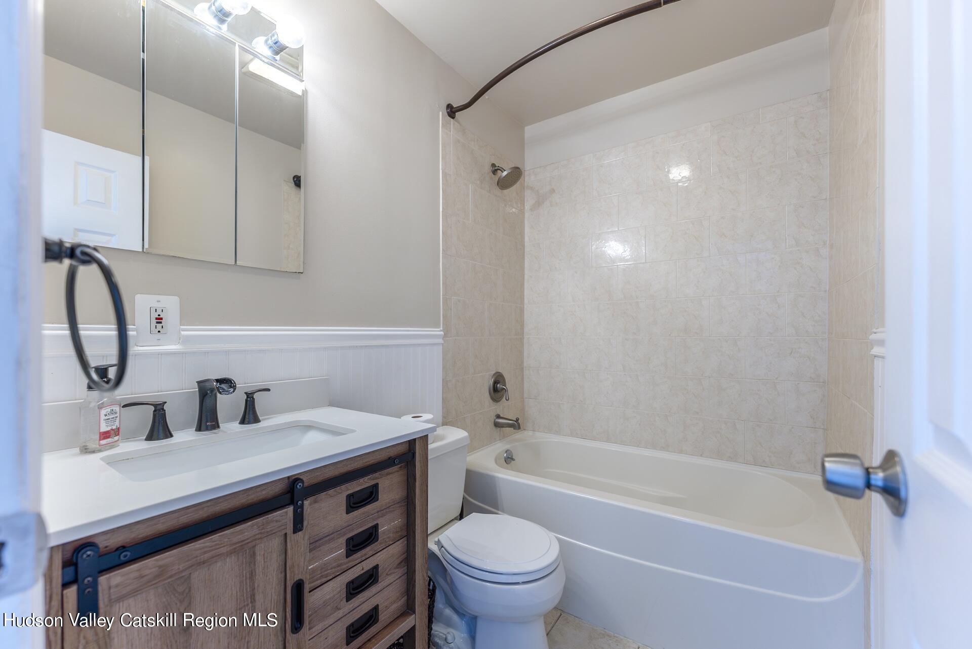 6 Colonial Road, Unit 46 Beacon, NY 12508 - Photo 16 of 19 a bathroom with a sink a toilet and a bathtub