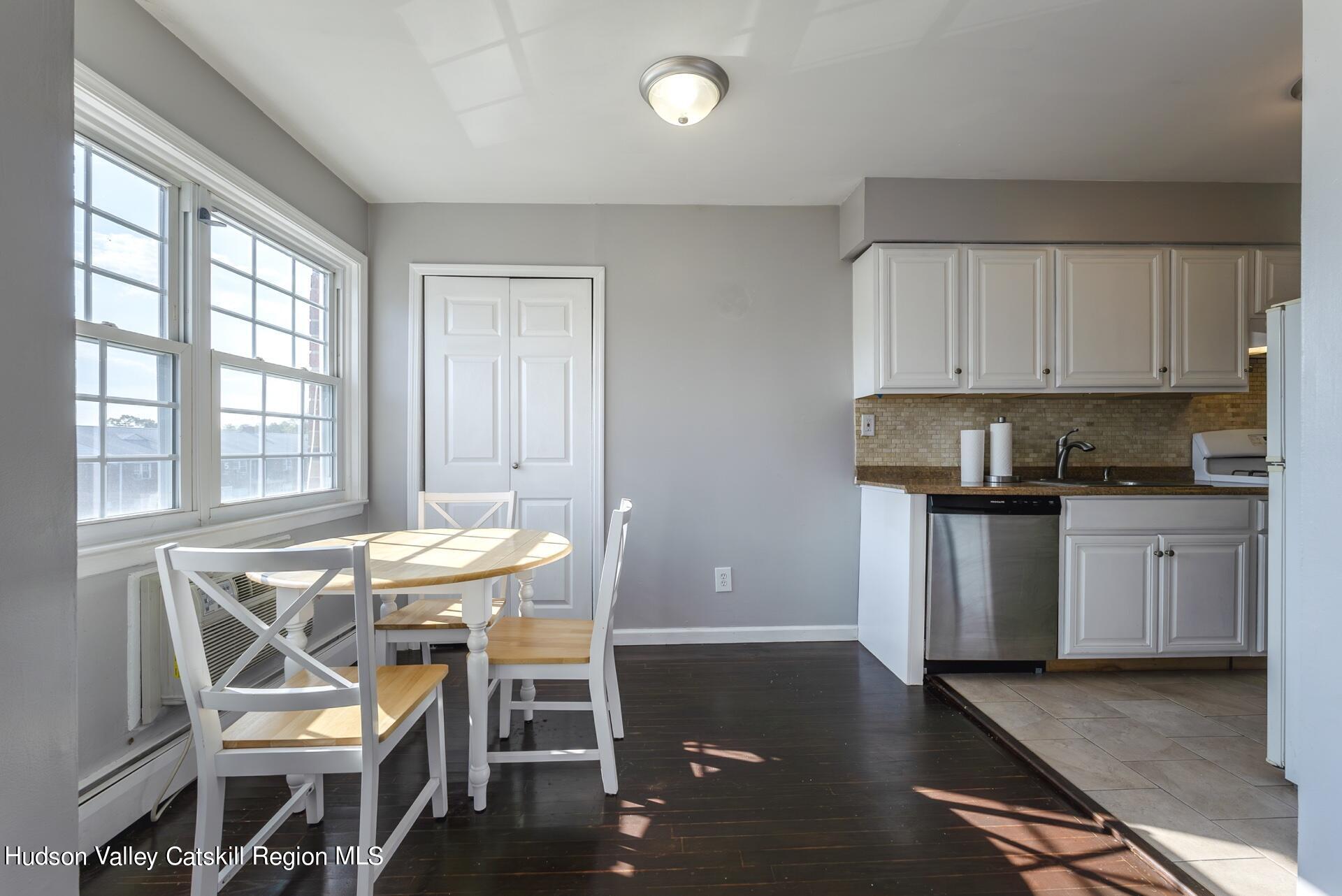 6 Colonial Road, Unit 46 Beacon, NY 12508 - Photo 7 of 19 a view of a dining room with furniture and wooden floor