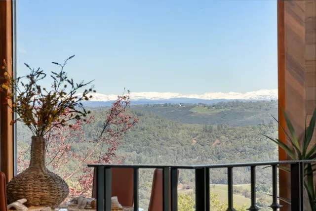 a view of a balcony with wooden fence