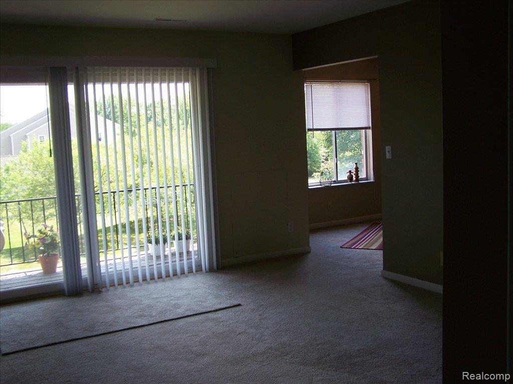 407 West Highland Road, Unit 5A Howell, MI 48843 - Photo 2 of 11 DOORWALL UNTO BALCONY