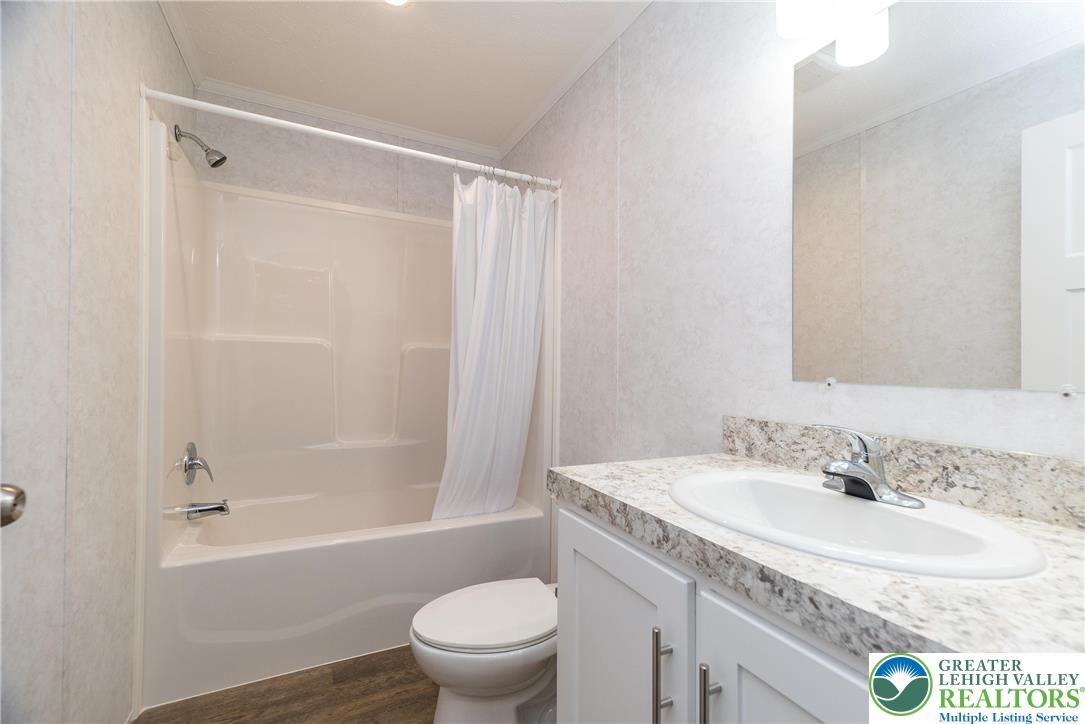 465 Royal Manor Road, Unit LOT 6 Easton, PA 18042 - Photo 20 of 25 a bathroom with a granite countertop sink toilet and shower