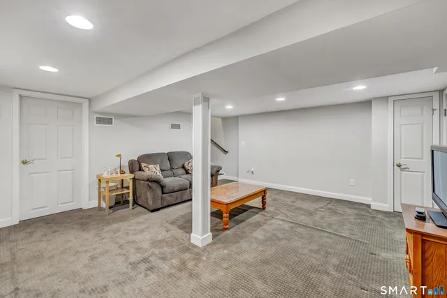 a living room with furniture and a couch