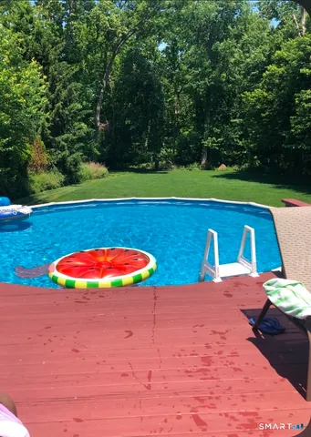 a view of outdoor space with swimming pool and patio