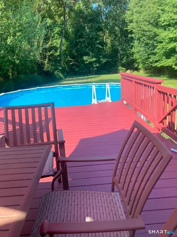 a view of a wooden deck with a bench