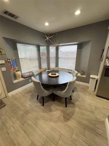 a view of a dining room with furniture