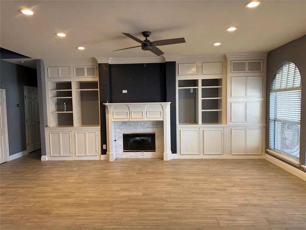 413 Ridge Meade Drive Lewisville, TX 75067 - Photo 21 of 23 a view of an empty room with a fireplace and a window
