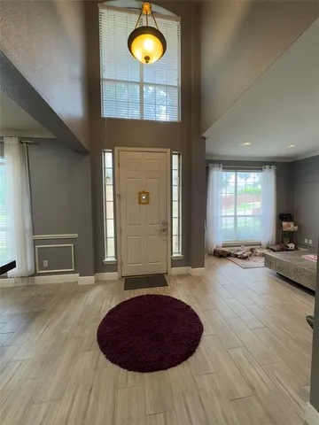 a view of a livingroom with furniture and window