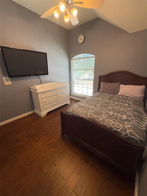 413 Ridge Meade Drive Lewisville, TX 75067 - Photo 8 of 23 a bed sitting in a bedroom next to a window