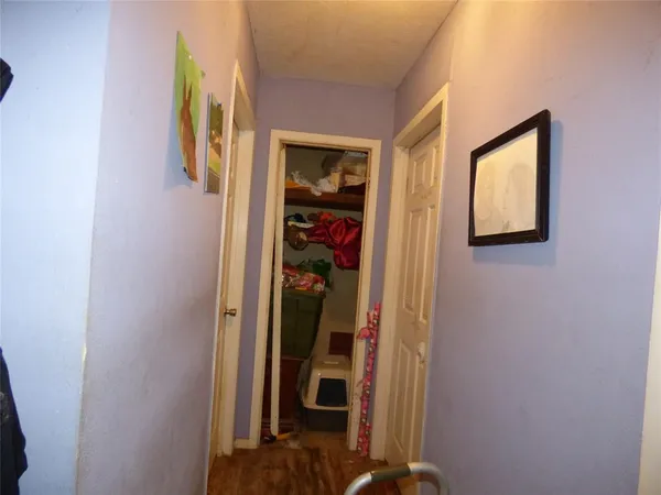 a living room with lots of furniture and gym equipment