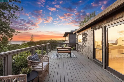 a bathroom with a double vanity sink toilet and mirror