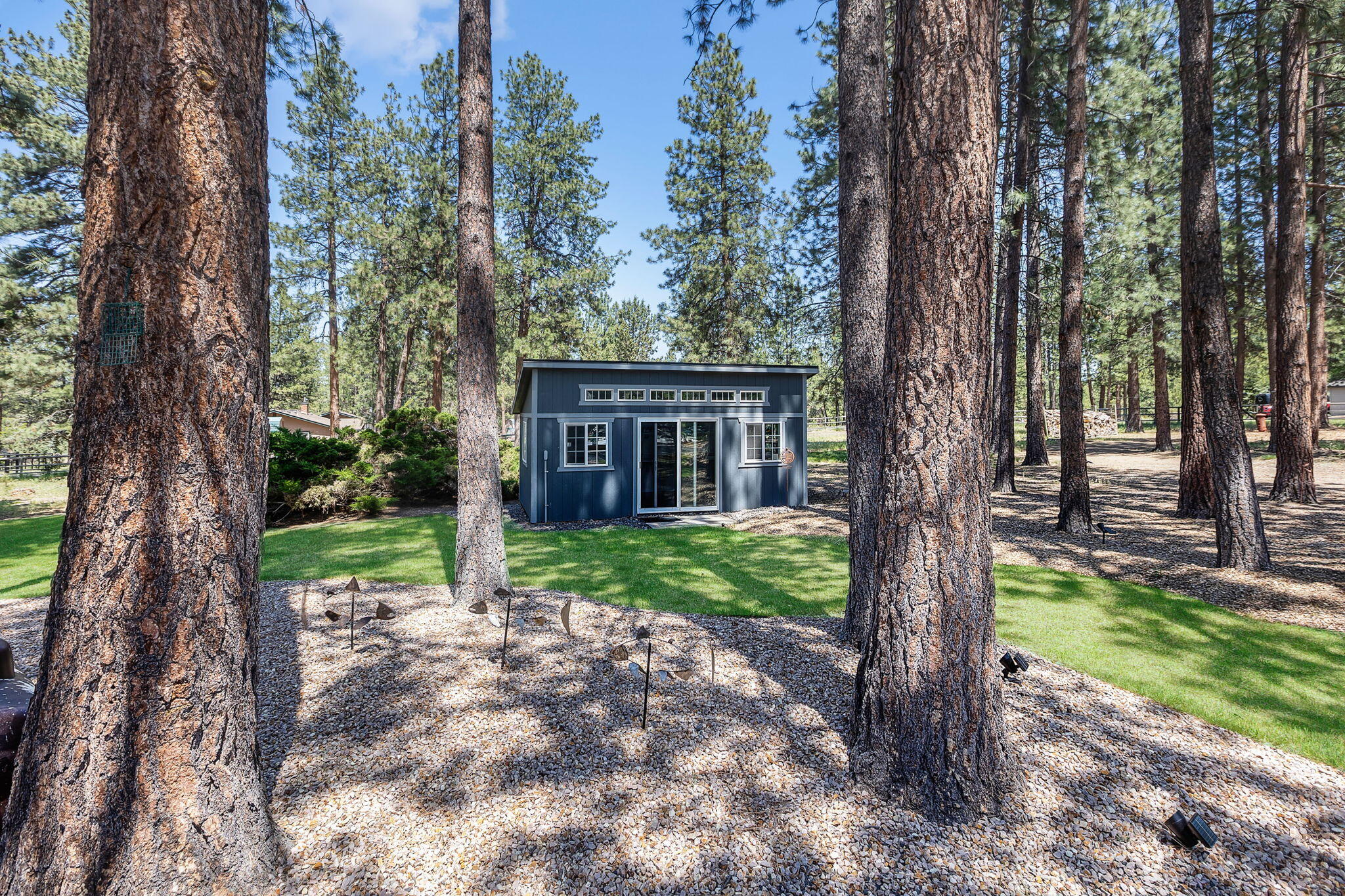 60210 East Ridgeview Drive Bend, OR 97702 - Photo 29 of 55 a view of a house with a tree in a yard