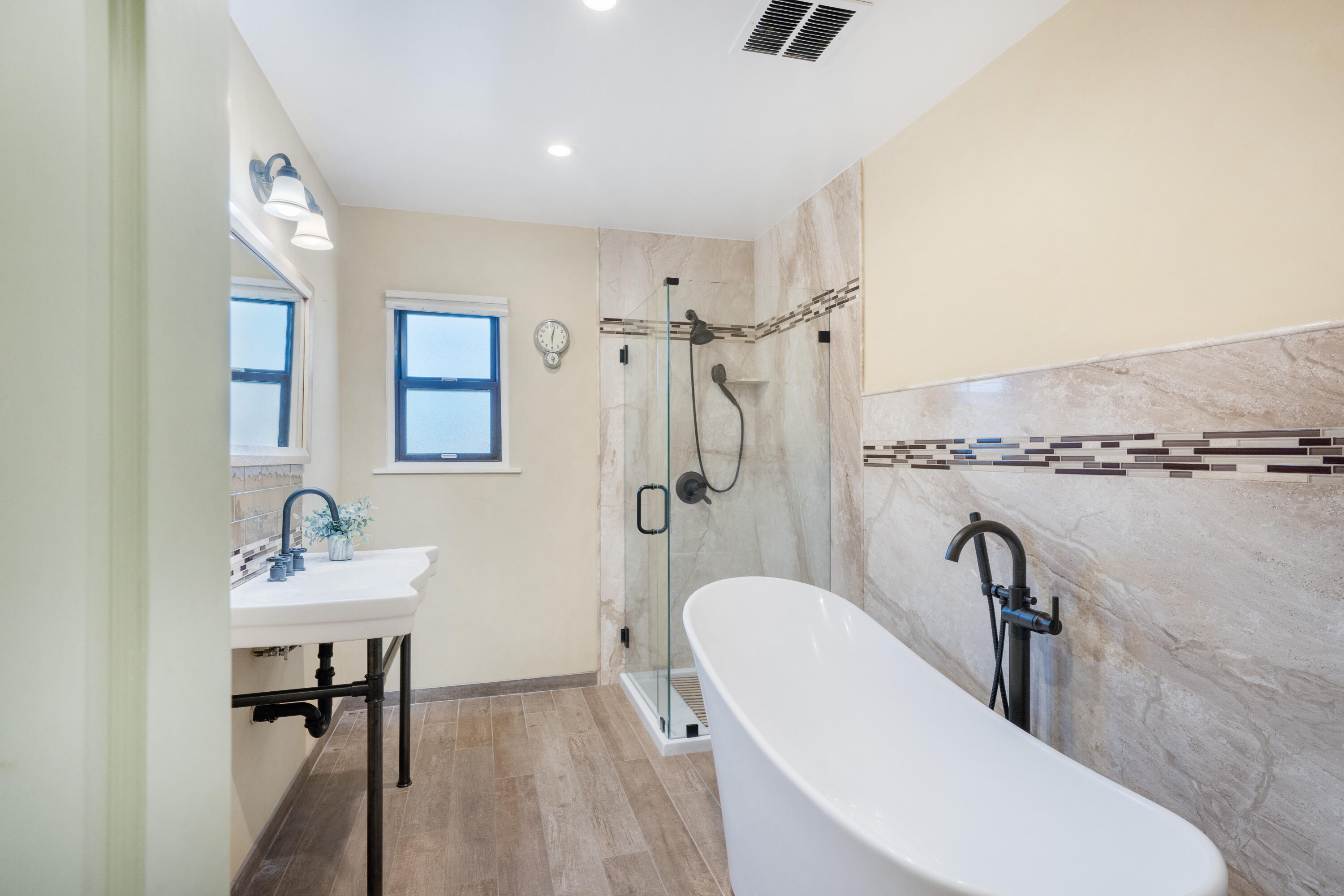 2620 Janin Way Solvang, CA 93463 - Photo 12 of 30 a bathroom with a sink mirror and a bathtub