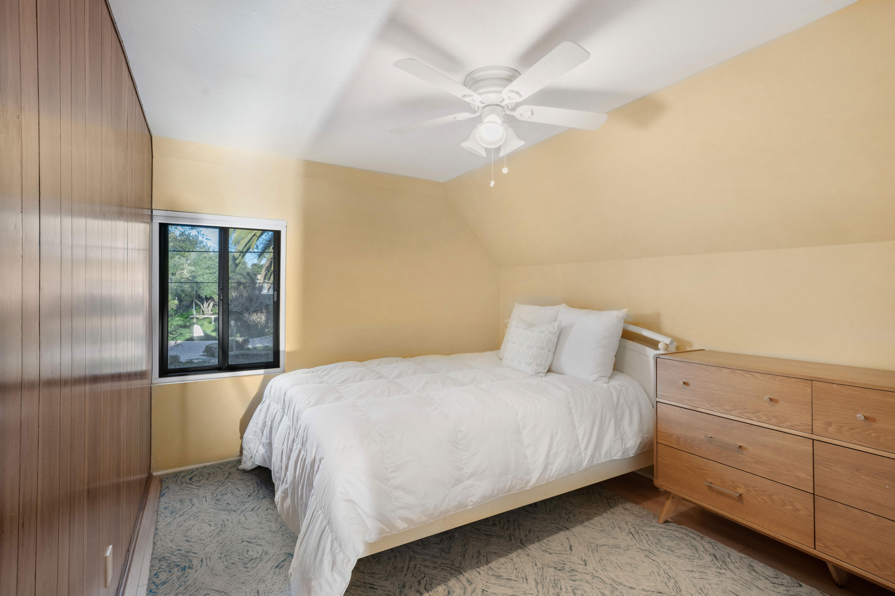 2620 Janin Way Solvang, CA 93463 - Photo 18 of 30 a bedroom with a bed and a chandelier