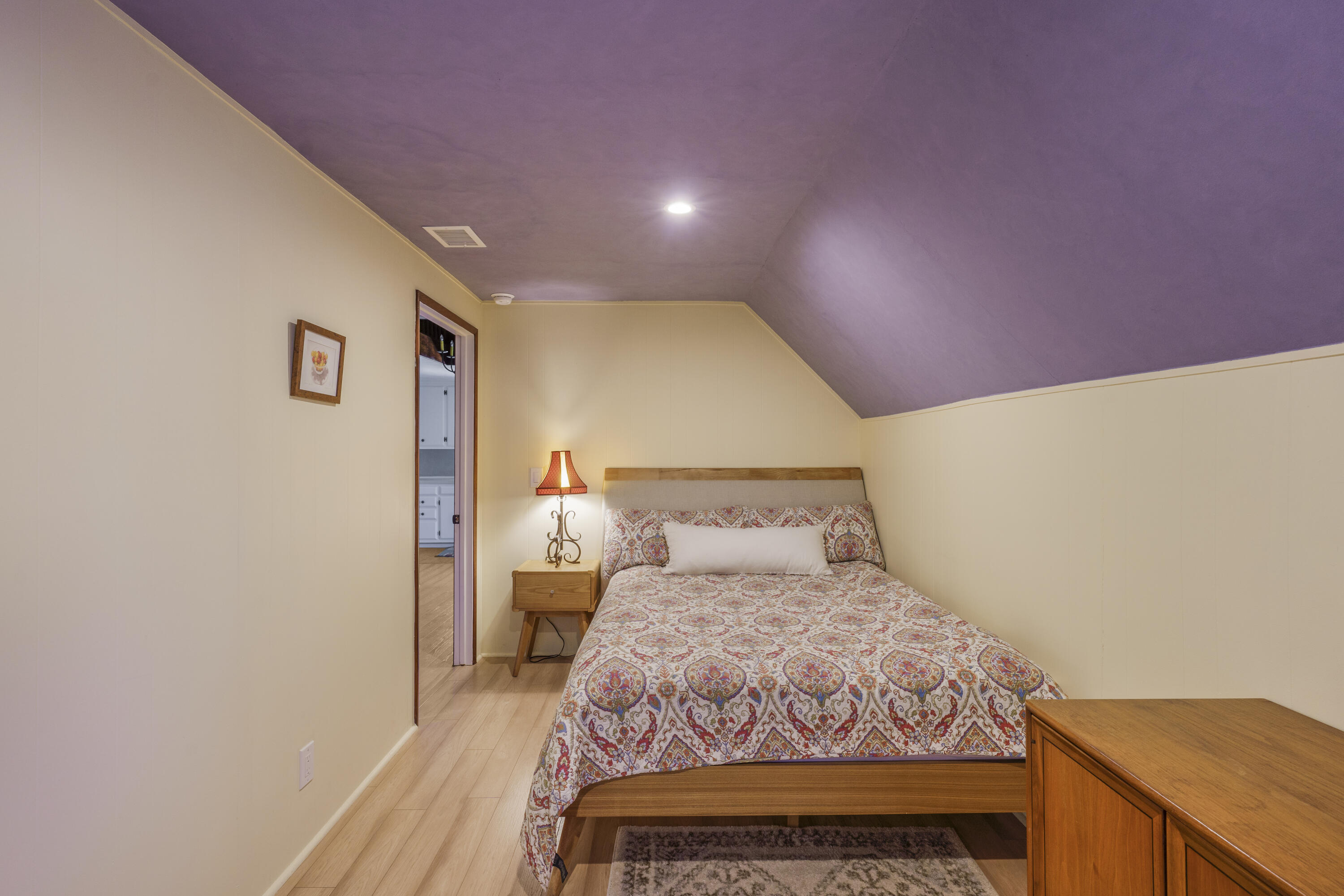 2620 Janin Way Solvang, CA 93463 - Photo 23 of 30 a bedroom with a bed and wooden floor