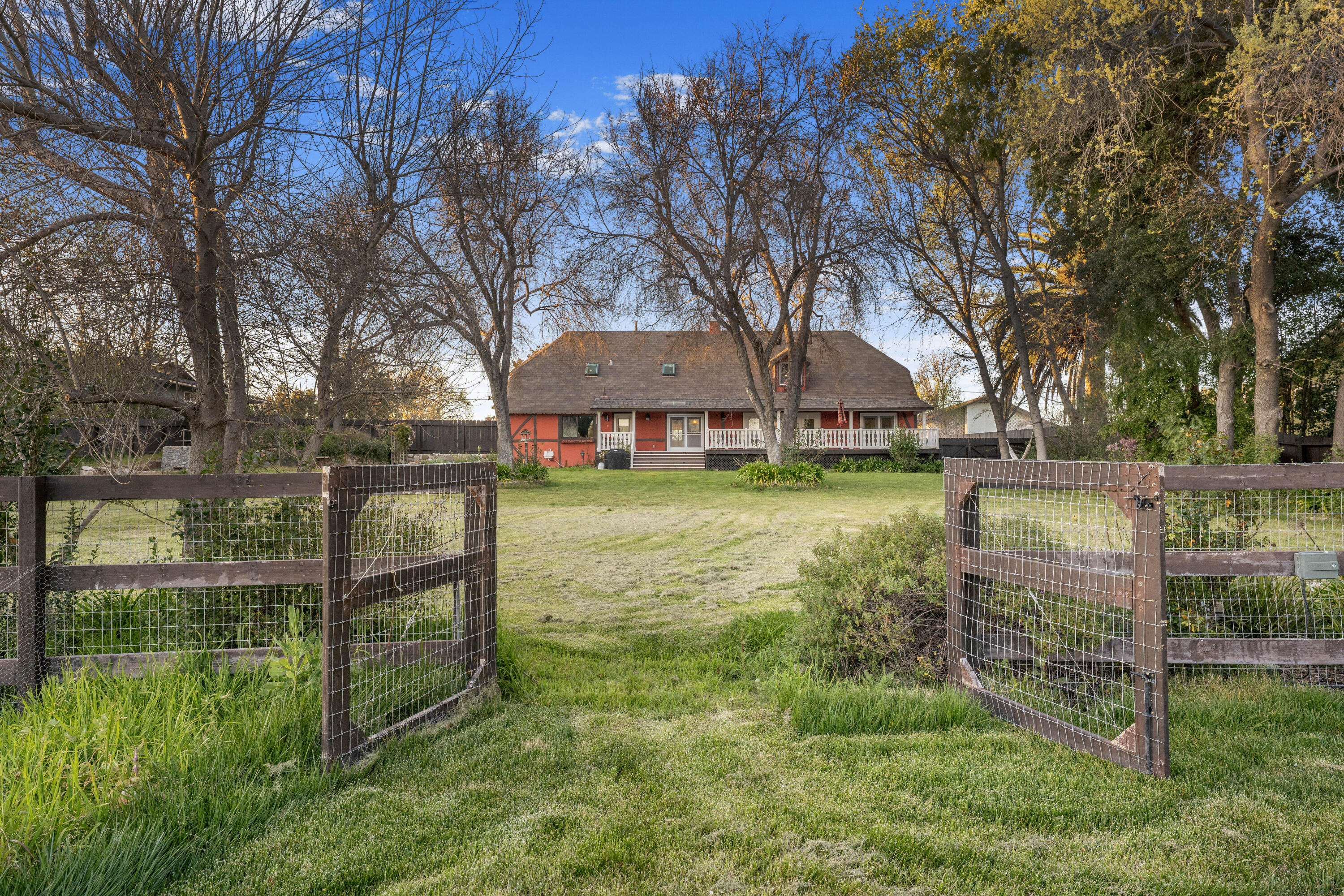 2620 Janin Way Solvang, CA 93463 - Photo 29 of 30 a view of a yard with large trees and a barn in it