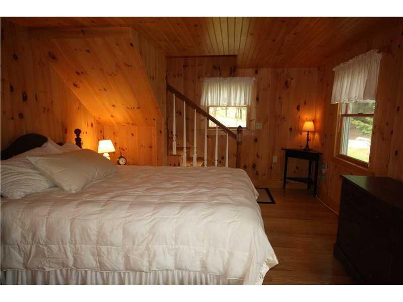 15 Ocean View Place Boothbay, ME 04544 - Photo 14 of 18 Bedroom. The stairs at the end of...