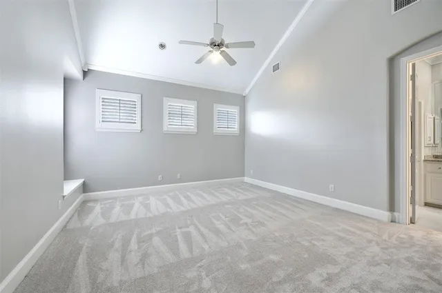 a bathroom with a granite countertop sink and a large mirror