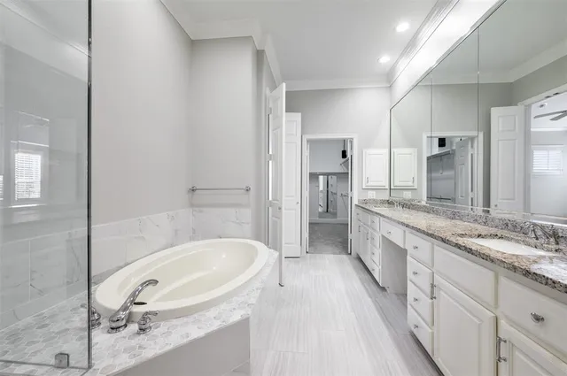 a view of a hallway with white walls and entryway