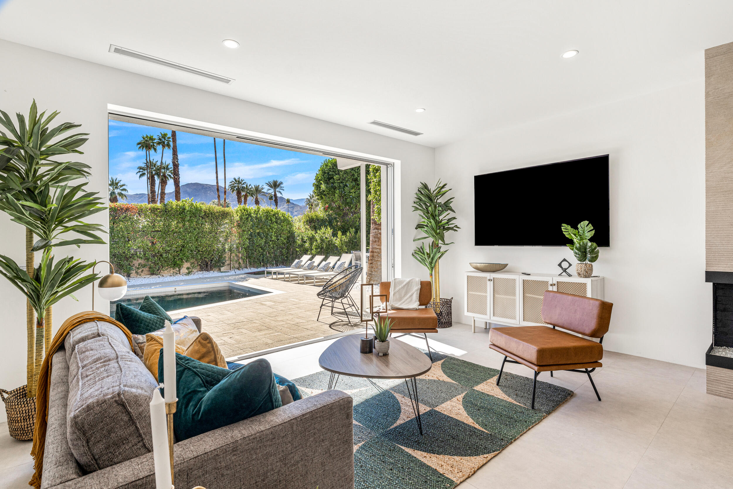 37521 Palm View Road Rancho Mirage, CA 92270 - Photo 12 of 61 a living room with furniture and a flat screen tv