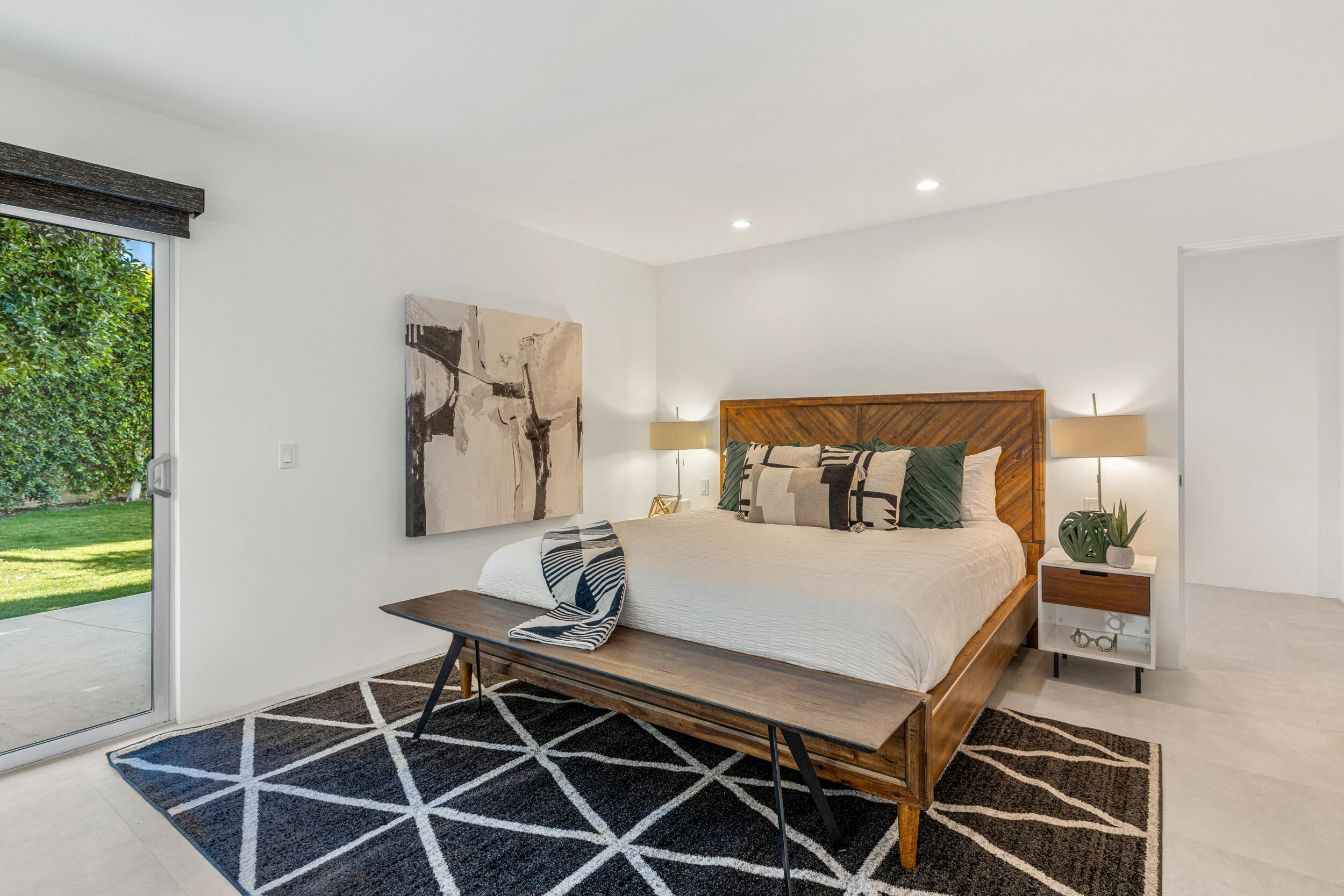 37521 Palm View Road Rancho Mirage, CA 92270 - Photo 23 of 61 a bedroom with a bed and a table in it