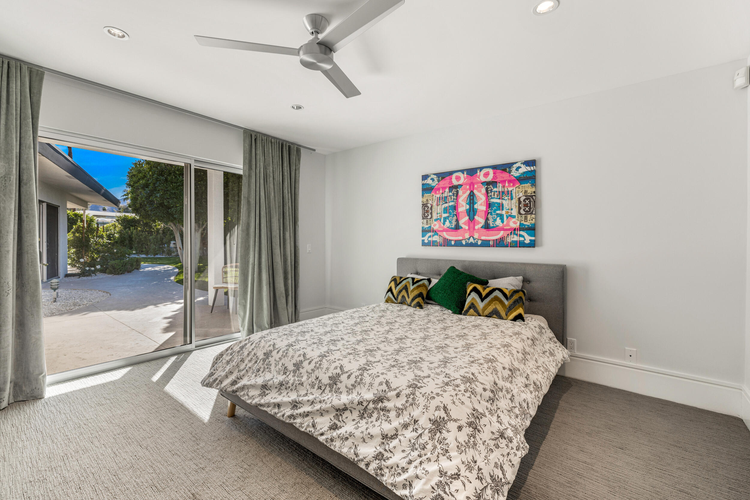 37521 Palm View Road Rancho Mirage, CA 92270 - Photo 33 of 61 a bedroom with a bed and a painting on the wall