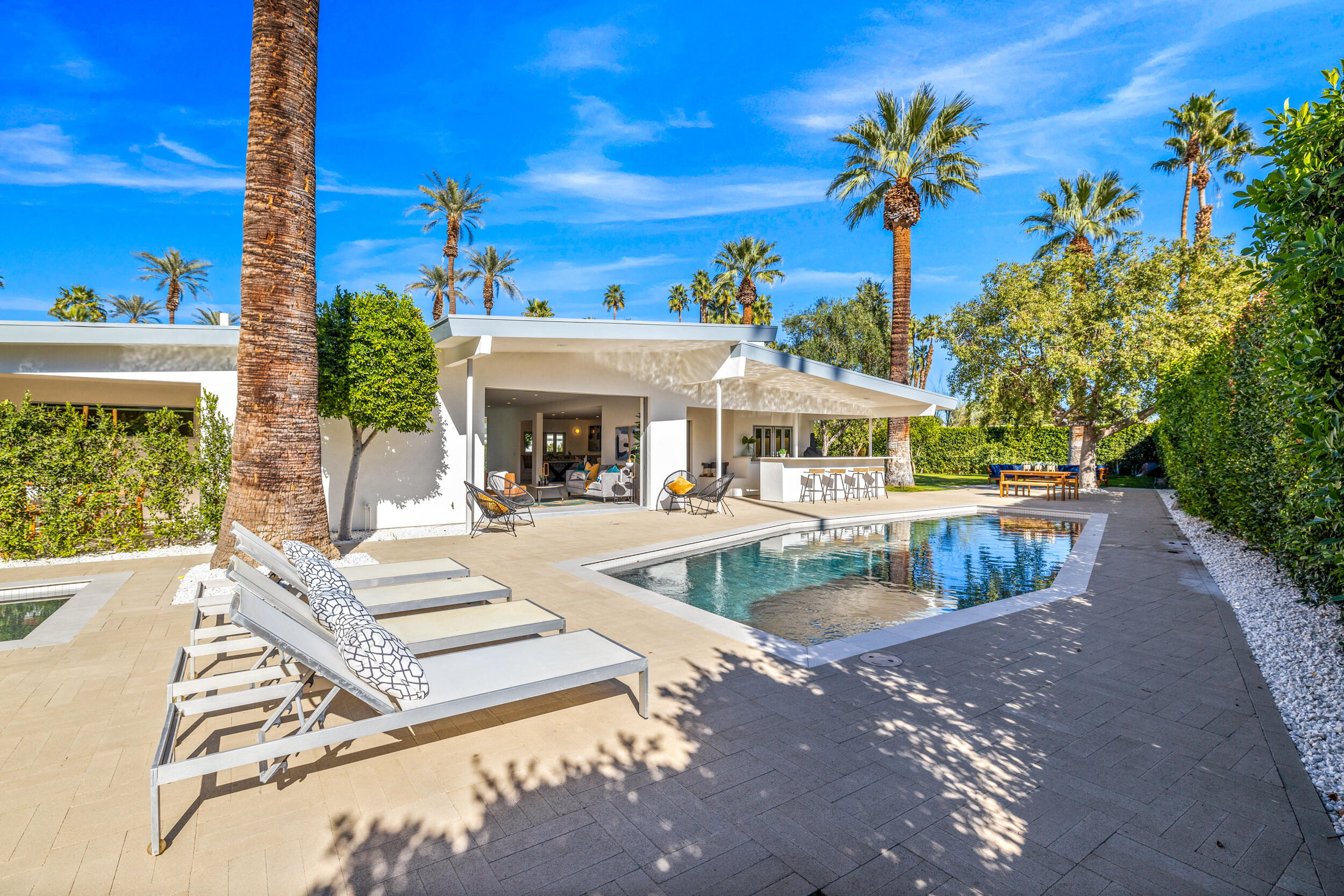 37521 Palm View Road Rancho Mirage, CA 92270 - Photo 45 of 61 a view of house with swimming pool and outdoor seating