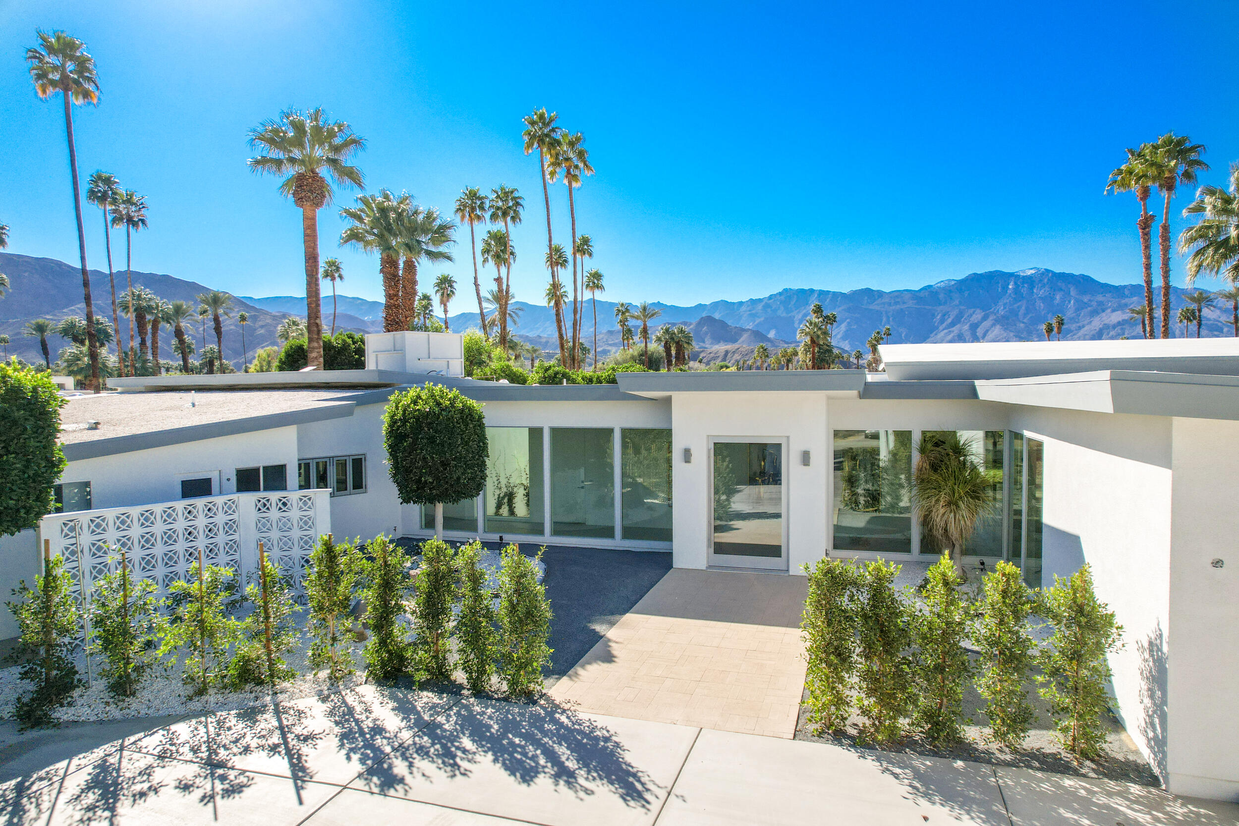 37521 Palm View Road Rancho Mirage, CA 92270 - Photo 61 of 61 a view of a house with a backyard and a garden