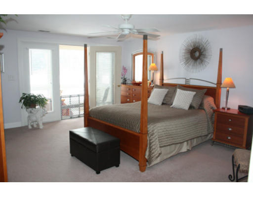 28 Beechwood Road Lynnfield, MA 01940 - Photo 6 of 11 a bedroom with a bed window and couch