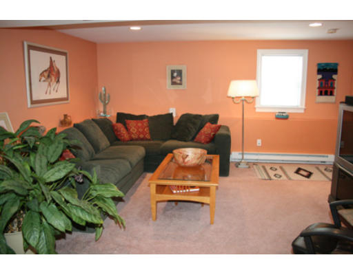 28 Beechwood Road Lynnfield, MA 01940 - Photo 8 of 11 a living room with furniture and a lamp