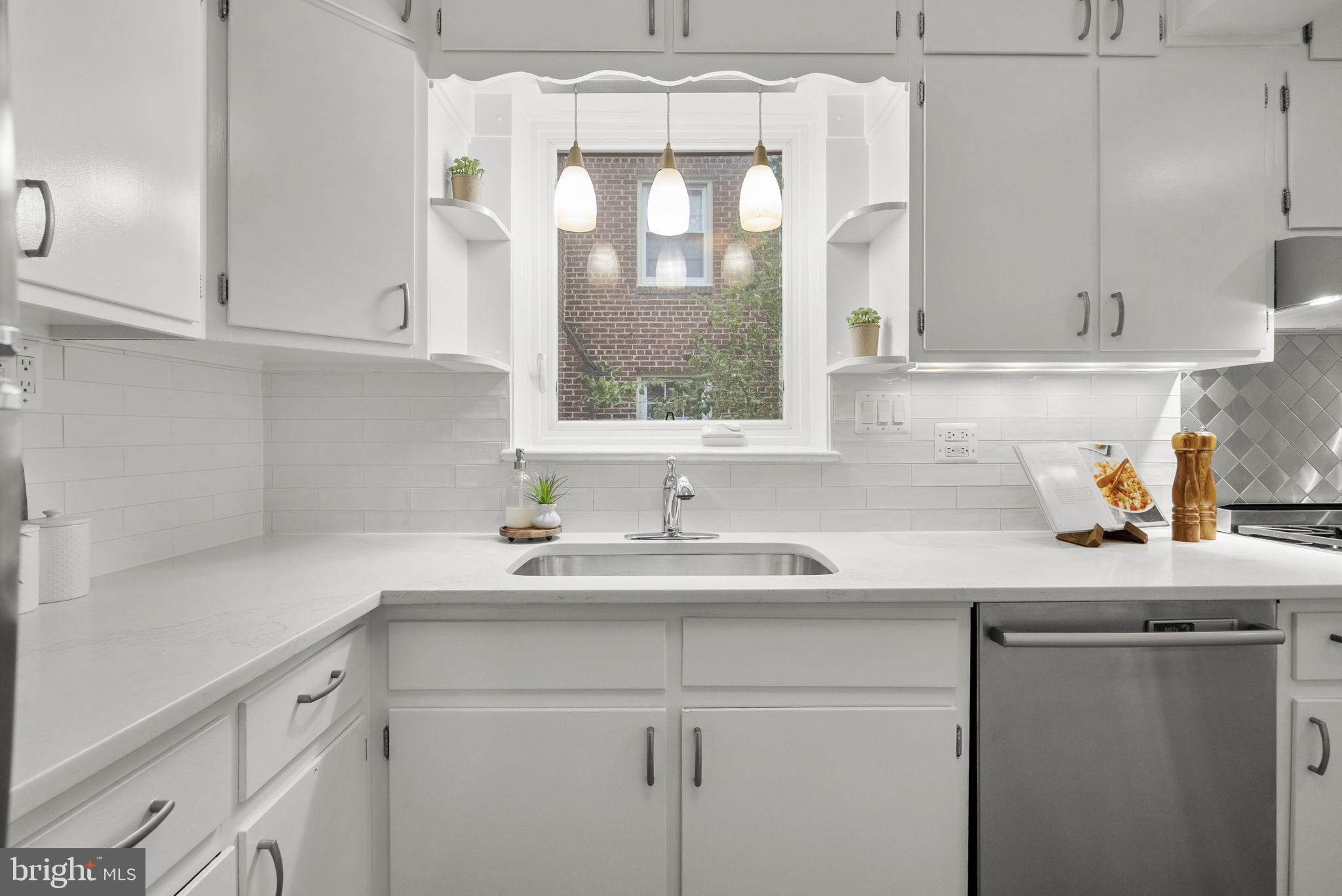 9407 Seminole Street Silver Spring, MD 20901 - Photo 16 of 59 Kitchen with Backsplash and Pendant Lighting