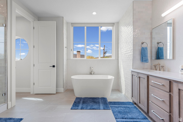 250 South Main Street, Unit 24 Alpine, UT 84004 - Photo 20 of 50 Full bathroom featuring a freestanding bath, vanity, and a shower stall
