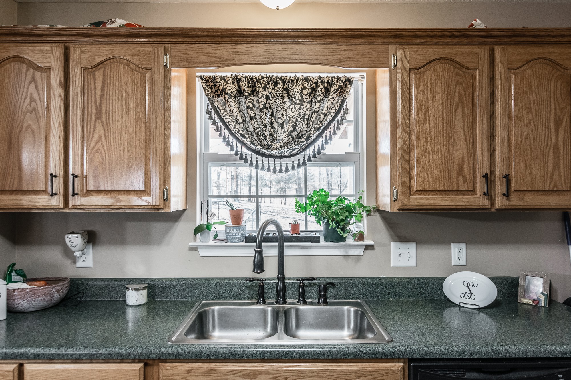 166 Switchboard Road Portland, TN 37148 - Photo 13 of 49 a kitchen with granite countertop a sink and a white wooden cabinets
