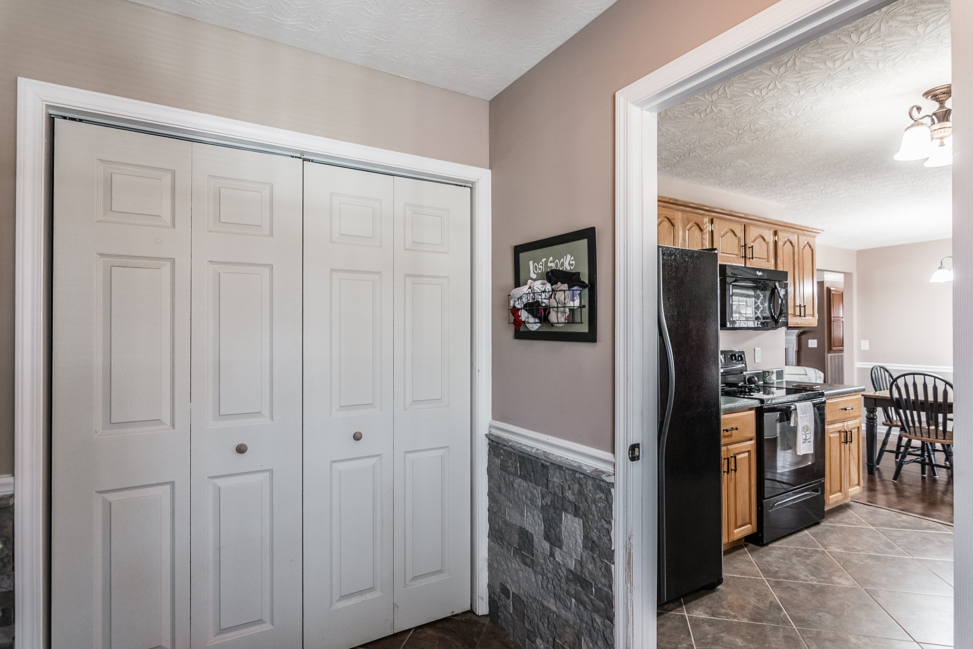 166 Switchboard Road Portland, TN 37148 - Photo 17 of 49 a view of a kitchen with refrigerator and dining table