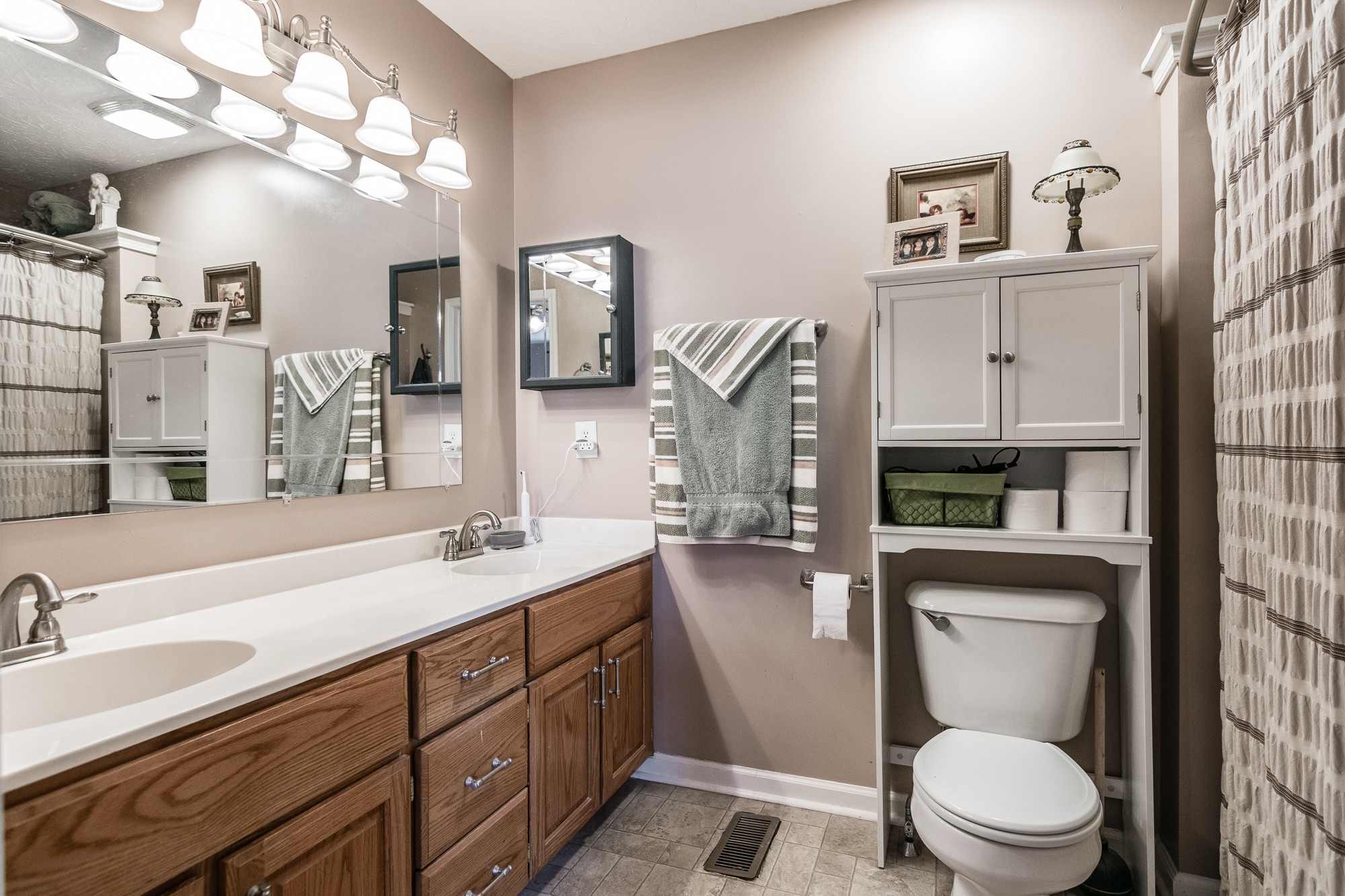 166 Switchboard Road Portland, TN 37148 - Photo 23 of 49 a bathroom with a toilet a sink and mirror