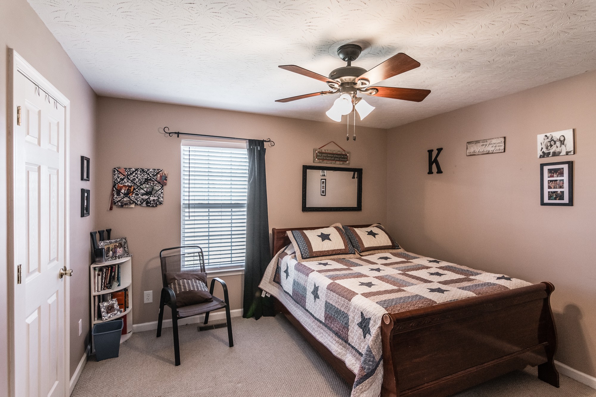 166 Switchboard Road Portland, TN 37148 - Photo 25 of 49 a bedroom with a bed and a chandelier