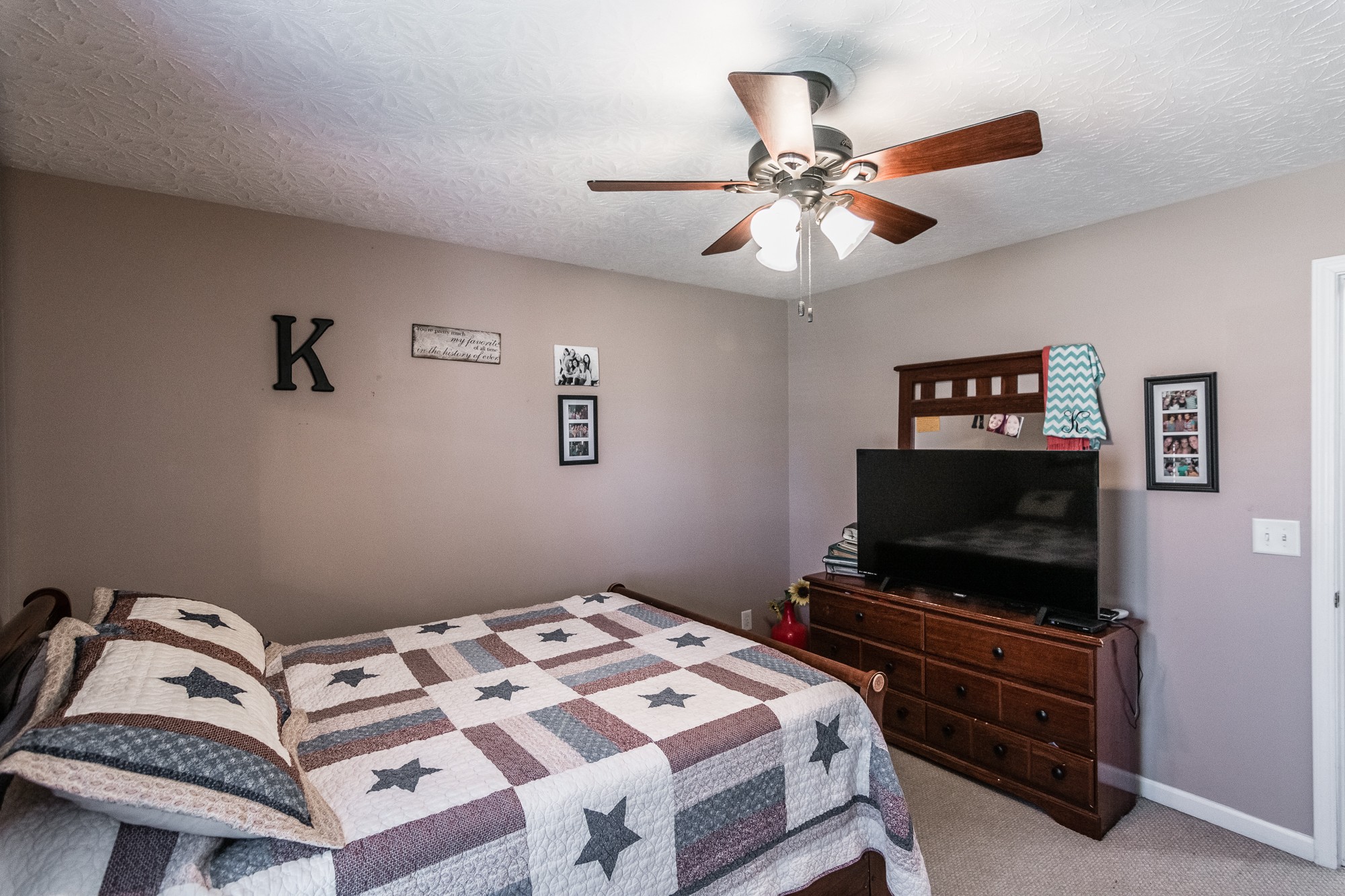 166 Switchboard Road Portland, TN 37148 - Photo 26 of 49 a bedroom with a bed and a flat screen tv