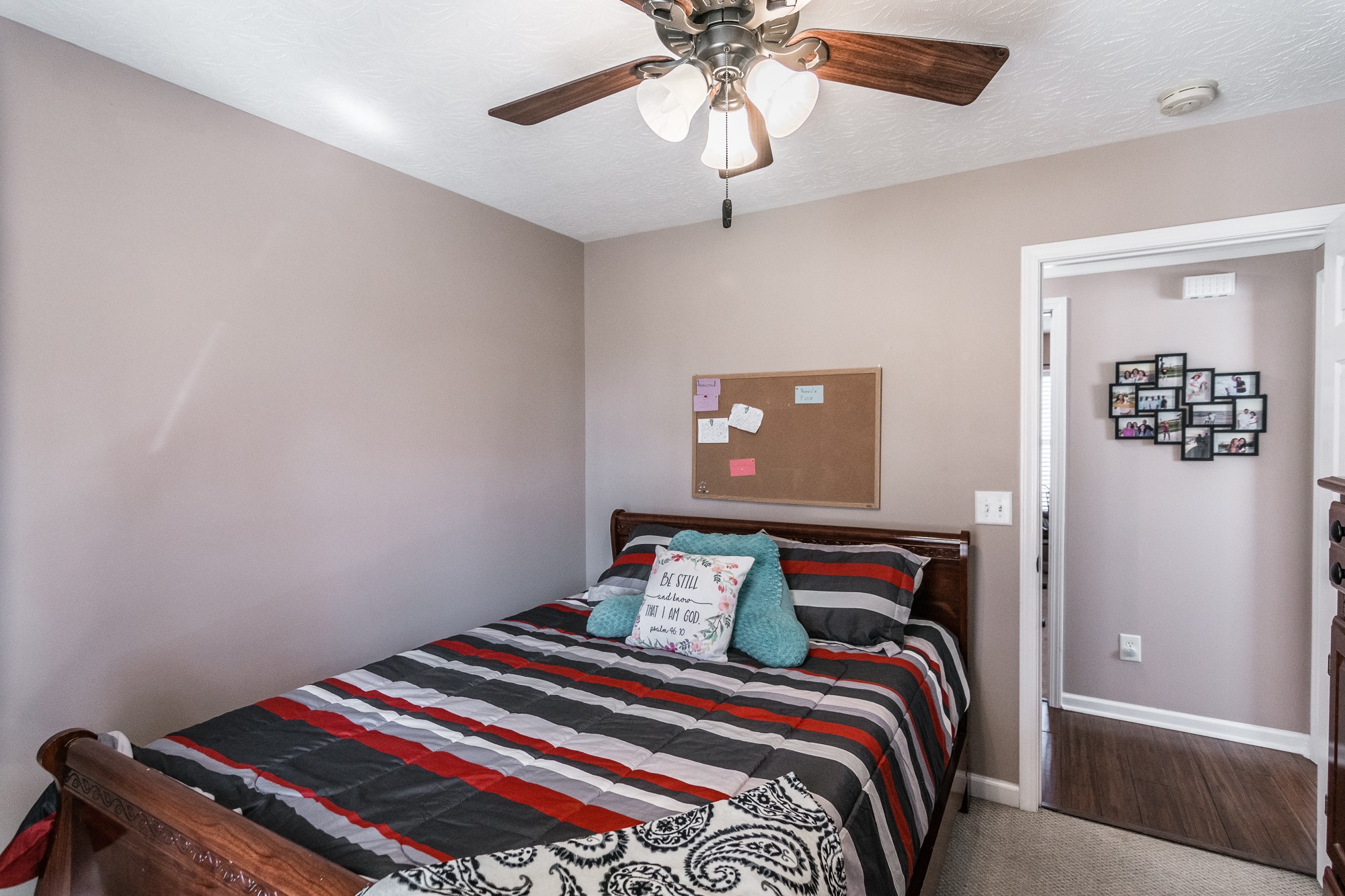 166 Switchboard Road Portland, TN 37148 - Photo 29 of 49 a bedroom with a bed and a chandelier