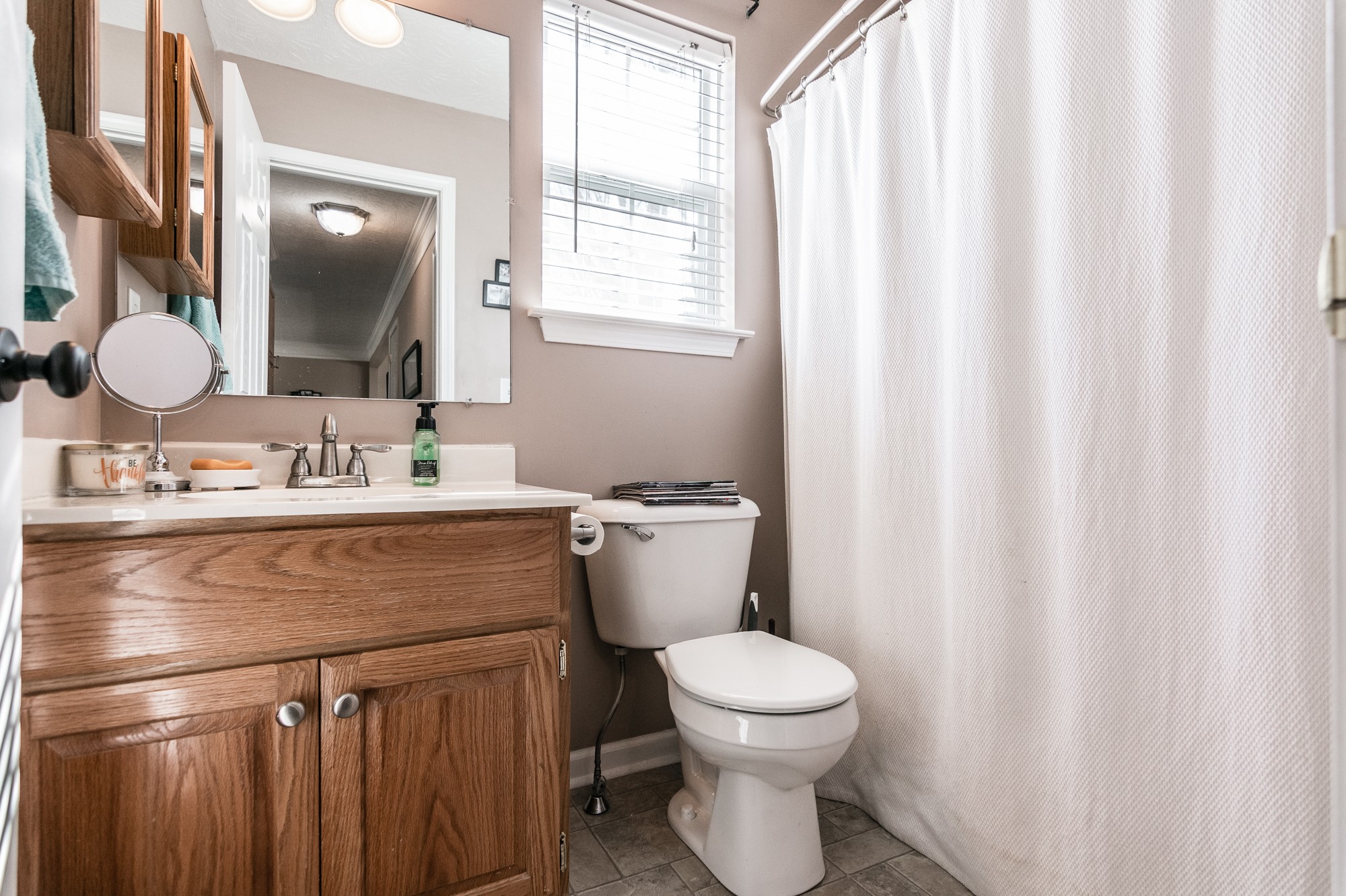 166 Switchboard Road Portland, TN 37148 - Photo 30 of 49 a bathroom with a sink toilet and mirror