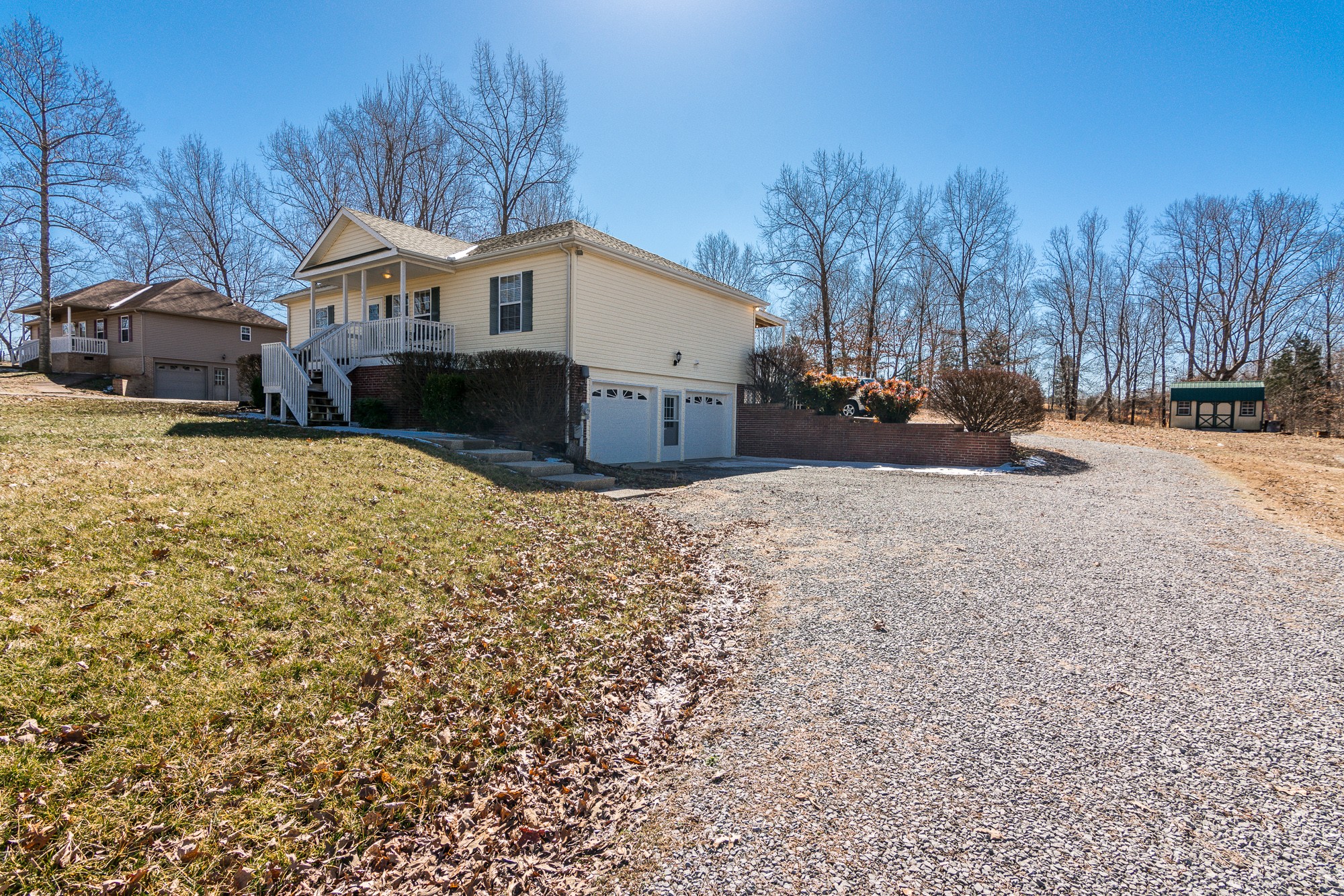 166 Switchboard Road Portland, TN 37148 - Photo 48 of 49 a view of a house with snow on the side of the road