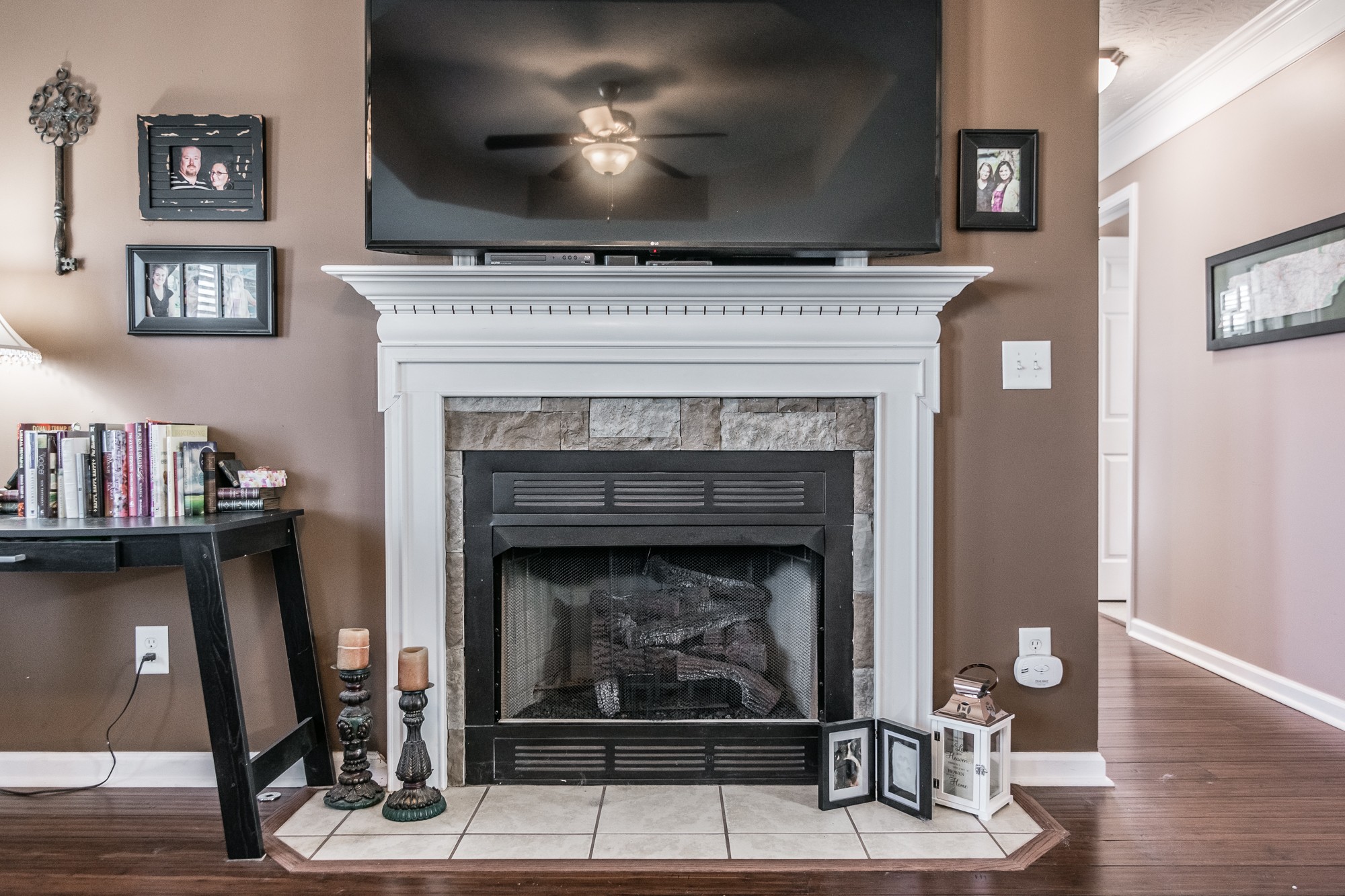 166 Switchboard Road Portland, TN 37148 - Photo 6 of 49 a living room with a fireplace and a flat screen tv
