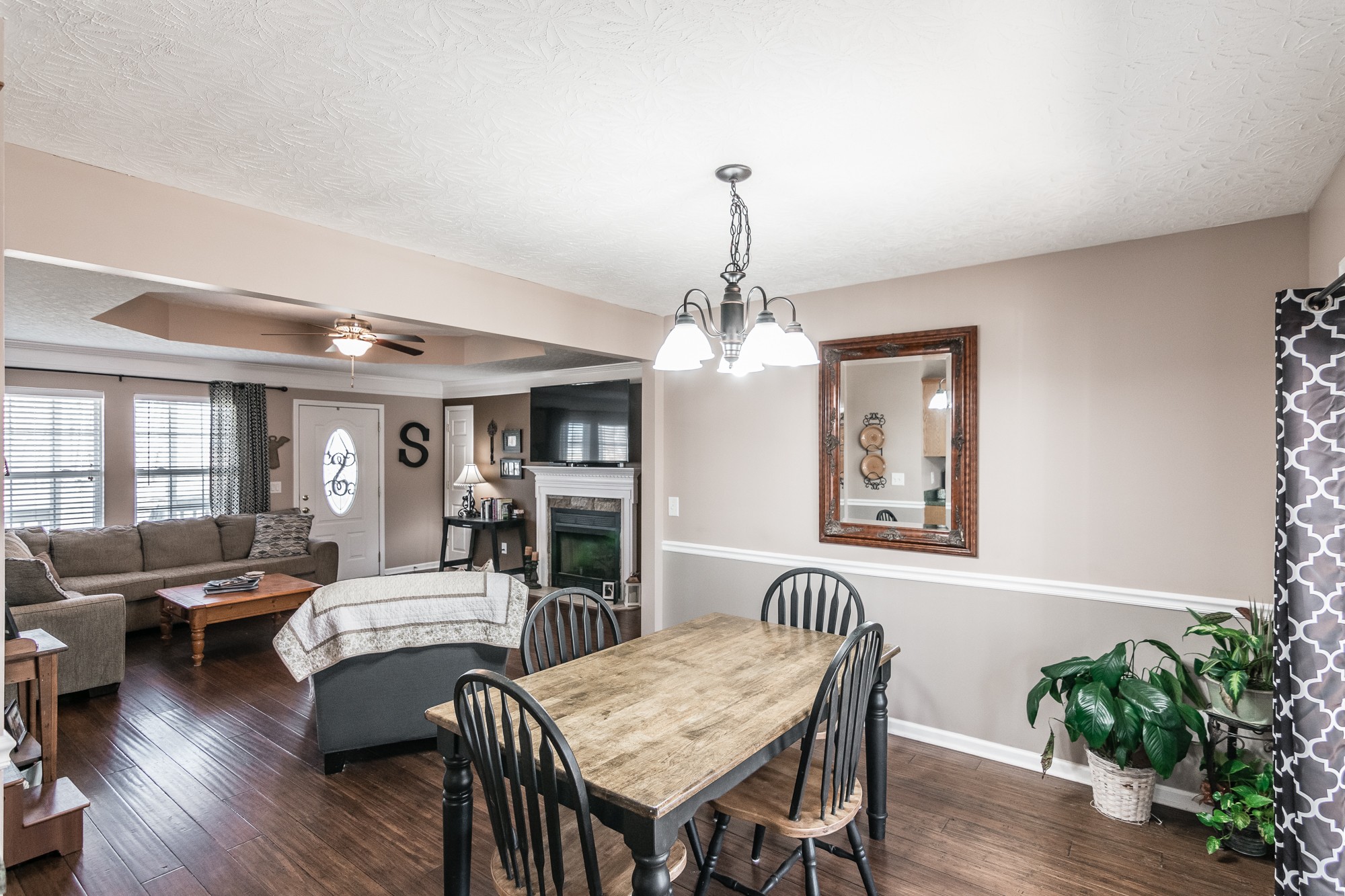 166 Switchboard Road Portland, TN 37148 - Photo 9 of 49 a view of a livingroom with furniture a chandelier and wooden floor