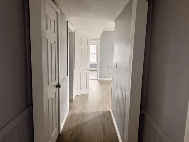 a view of a bathroom from a hallway