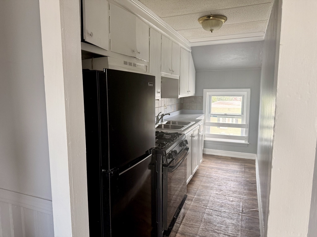 270 Stetson Street, Unit 3 Fall River, MA 02720 - Photo 6 of 9 a kitchen with stainless steel appliances a refrigerator and a stove