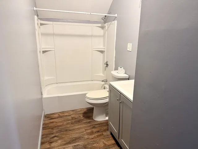 a bathroom with a toilet a sink and a bathtub