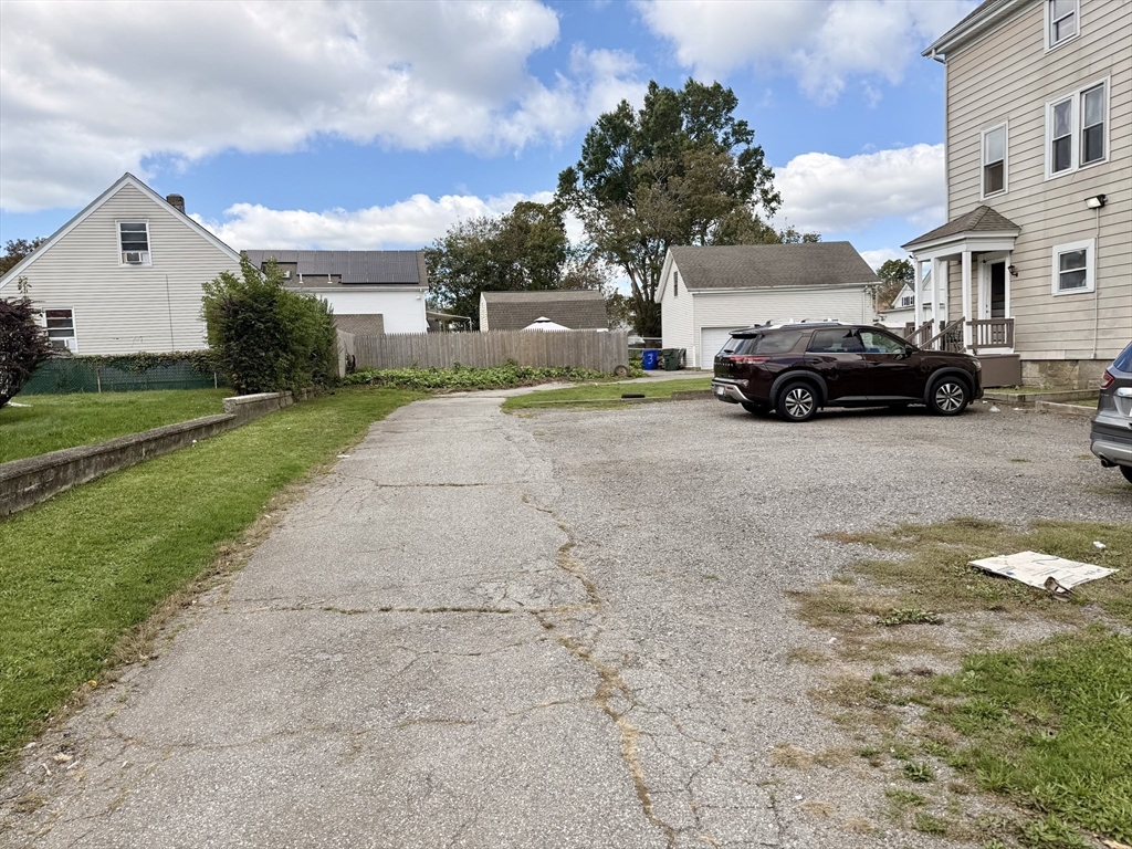 270 Stetson Street, Unit 3 Fall River, MA 02720 - Photo 8 of 9 a view of multiple houses with a yard