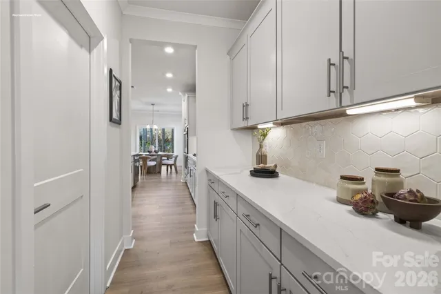 a kitchen with stainless steel appliances granite countertop a sink and cabinets