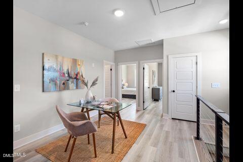 2126 Titanium Rock Road Durham, NC 27704 - Photo 12 of 20 a view of a room with furniture and wooden floor