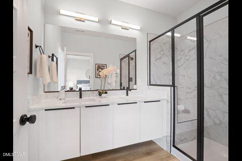 2126 Titanium Rock Road Durham, NC 27704 - Photo 18 of 20 a bathroom with a double vanity sink mirror and shower