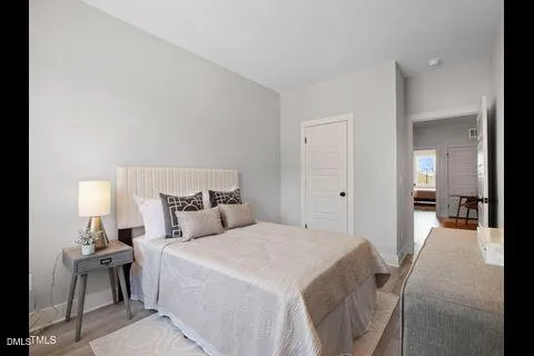 a bedroom with a bed and a table